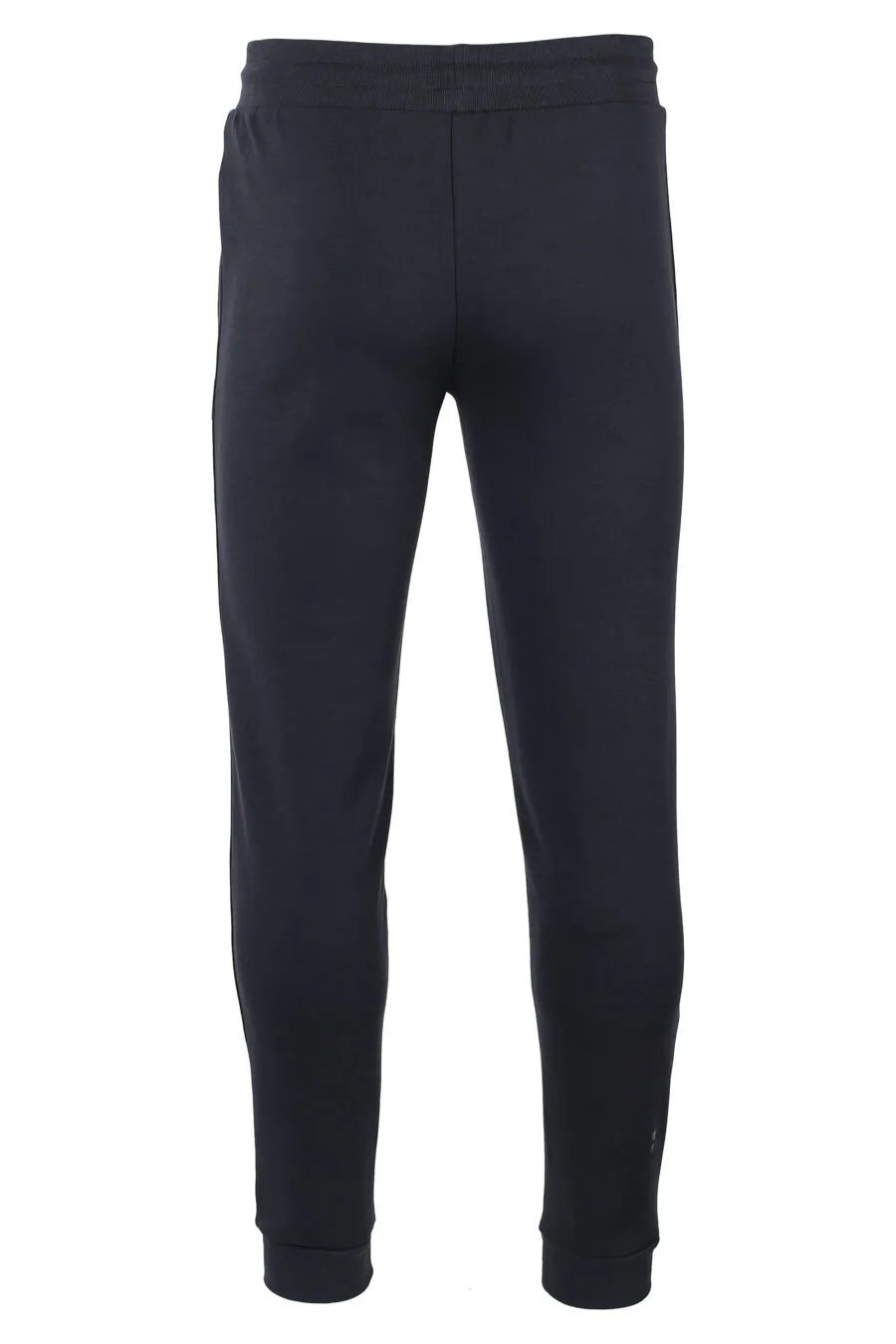 Pantalón de chándal azul oscuro con minilogo dorado en placa